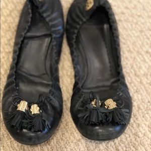 Black flats with gold tassels
